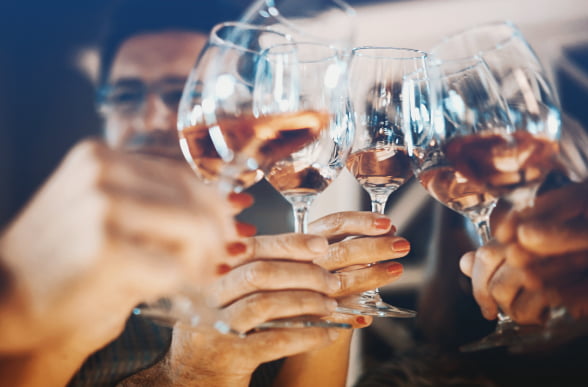 People toasting with glasses of wine