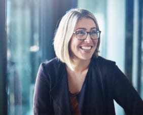Woman with glasses smiling