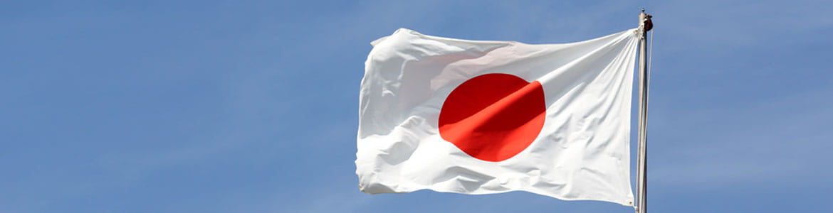 Japan flag against a blue sky