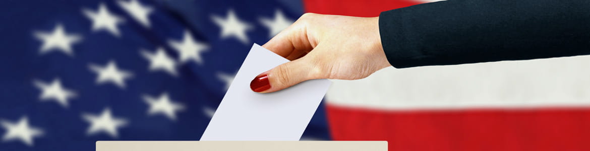 US American flag with a vote being posted in ballot box